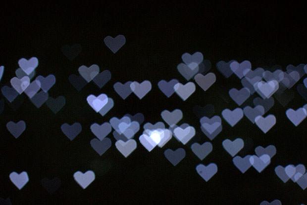 Blue heart bokeh on a black background